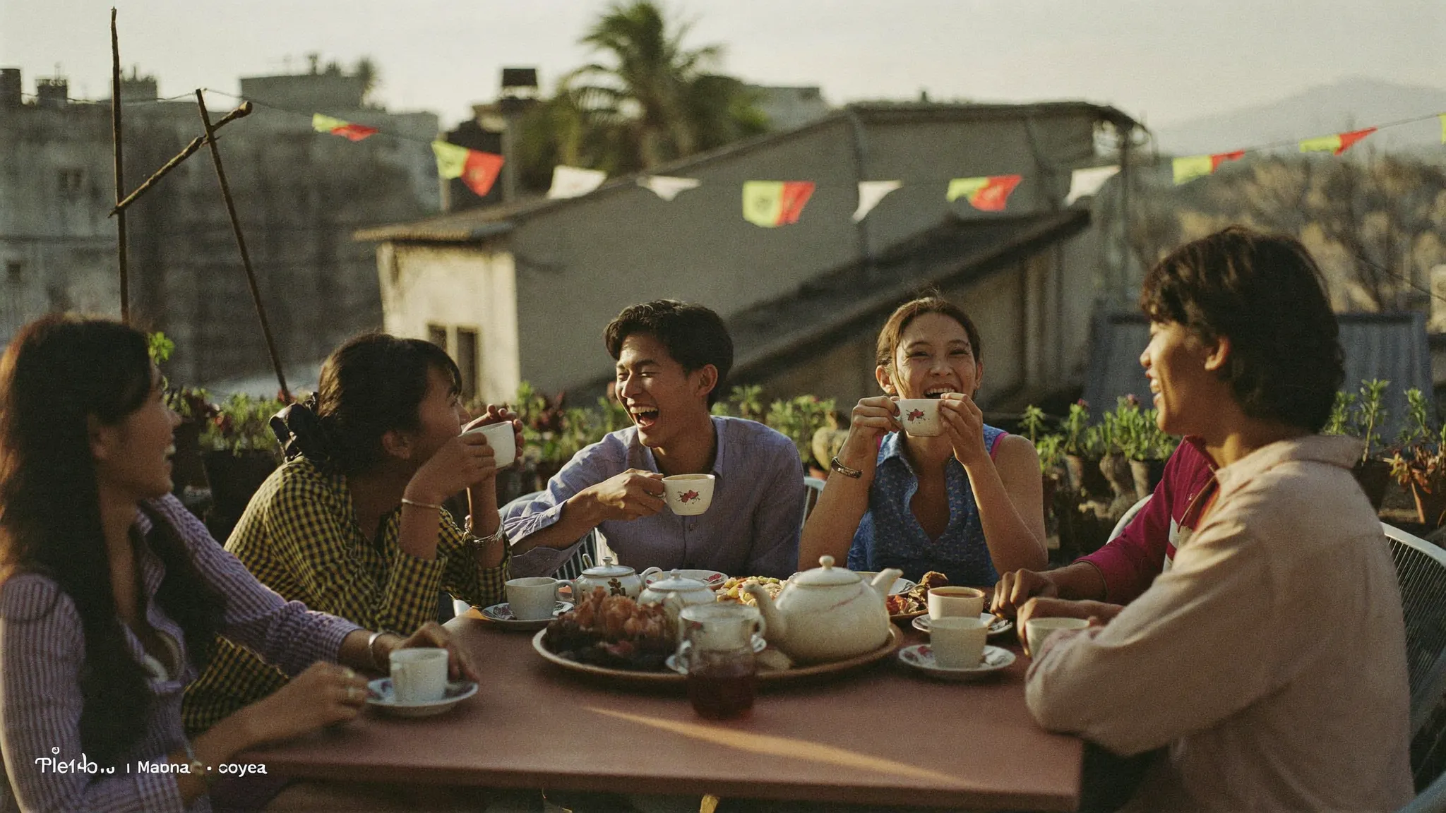 Nepali friends laughing over tea on a Kathmandu rooftop